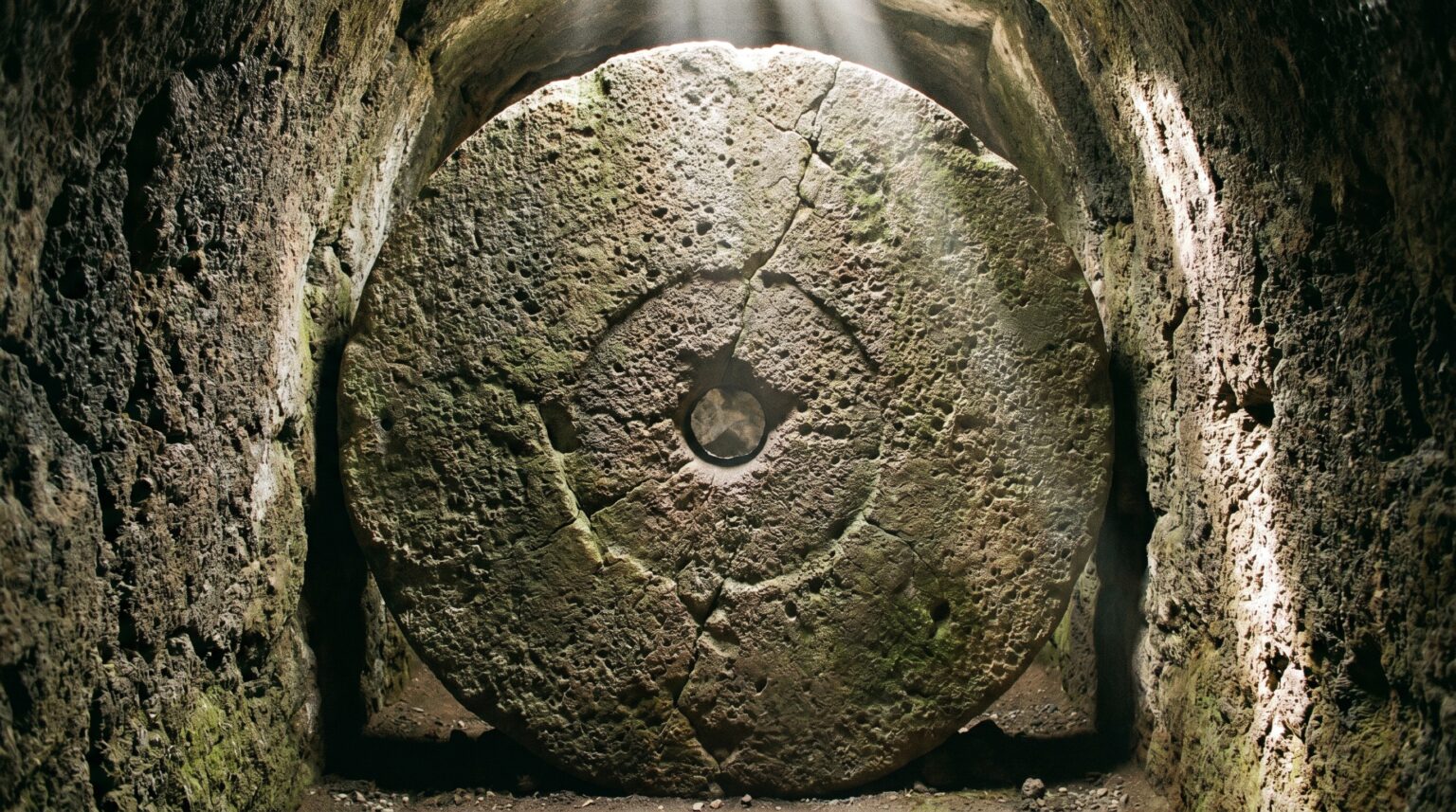 A massive circular stone security door inside the Derinkuyu Underground City